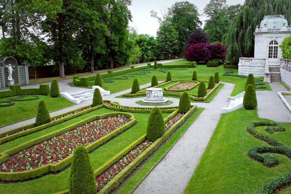 a-fancy-landscaped-park-or-garden-with-flowers-and-highly-groomed